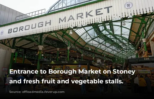 Entrance to Borough Market on Stoney Street and fresh fruit and vegetable stalls.