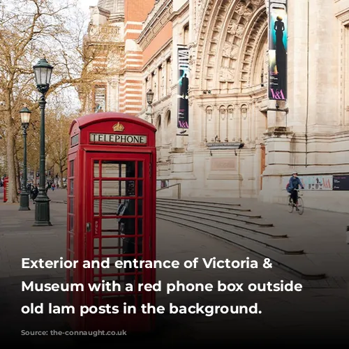 Exterior and entrance of Victoria & Albert Museum with a red phone box outside and old lam posts in the background.