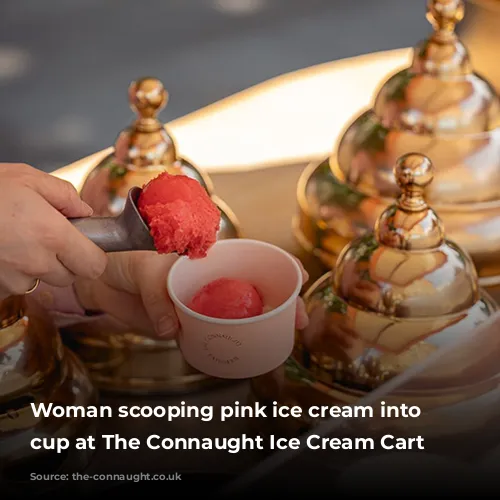 Woman scooping pink ice cream into a cup at The Connaught Ice Cream Cart