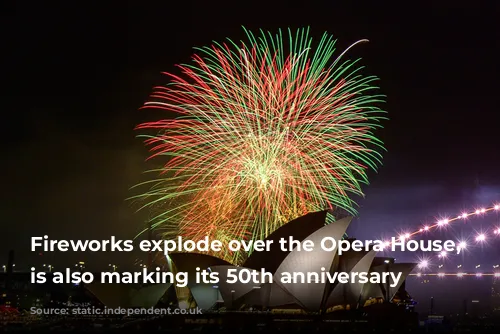 Fireworks explode over the Opera House, which is also marking its 50th anniversary