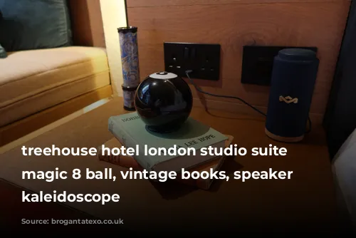 treehouse hotel london studio suite with magic 8 ball, vintage books, speaker and kaleidoscope 