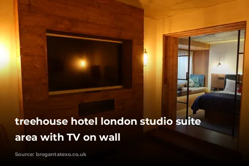 treehouse hotel london studio suite lounge area with TV on wall