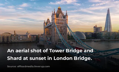 An aerial shot of Tower Bridge and The Shard at sunset in London Bridge.