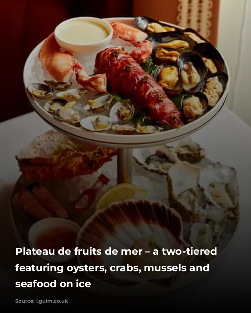 Plateau de fruits de mer – a two-tiered stand featuring oysters, crabs, mussels and other seafood on ice