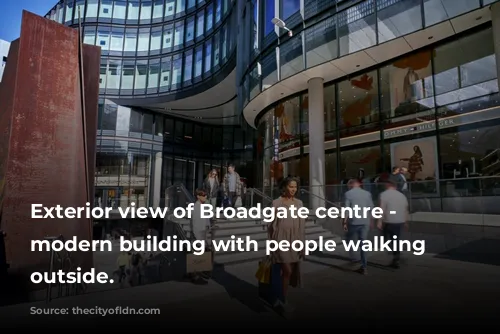 Exterior view of Broadgate centre - a modern building with people walking around outside.