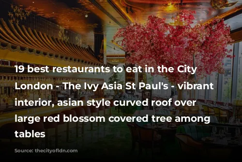 19 best restaurants to eat in the City of London - The Ivy Asia St Paul's - vibrant restaurant interior, asian style curved roof over bar, large red blossom covered tree among dinning tables