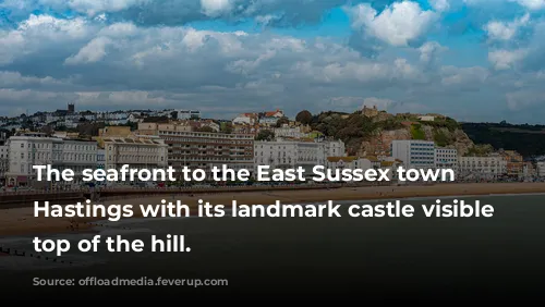 The seafront to the East Sussex town of Hastings with its landmark castle visible on top of the hill.