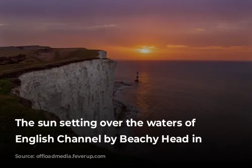 The sun setting over the waters of the English Channel by Beachy Head in Eastbourne