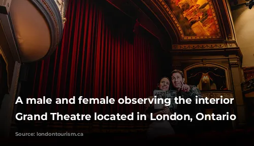 A male and female observing the interior of Grand Theatre located in London, Ontario