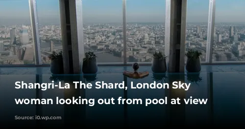 Shangri-La The Shard, London Sky Pool woman looking out from pool at view