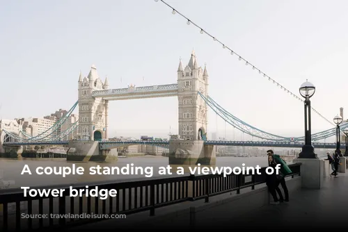 A couple standing at a viewpoint of the Tower bridge