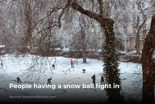 People having a snow ball fight in London