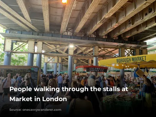 People walking through the stalls at Borough Market in London