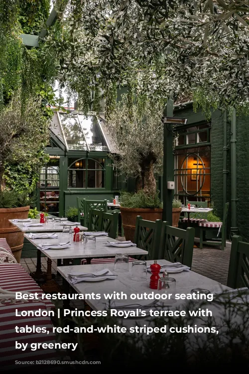 Best restaurants with outdoor seating in London | Princess Royal's terrace with marble tables, red-and-white striped cushions, shaded by greenery