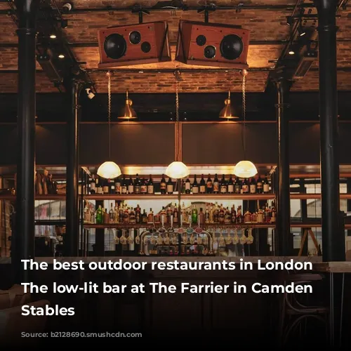 The best outdoor restaurants in London | The low-lit bar at The Farrier in Camden Market Stables