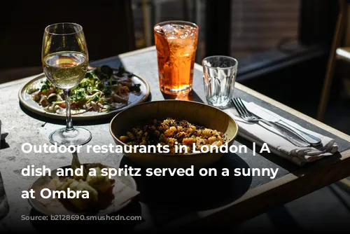 Outdoor restaurants in London | A pasta dish and a spritz served on a sunny table at Ombra