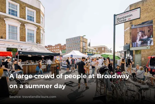 A large crowd of people at Broadway Market on a summer day