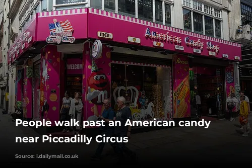 People walk past an American candy store near Piccadilly Circus