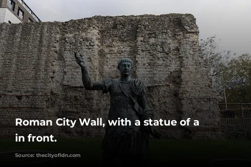 Roman City Wall, with a statue of a Roman in front.