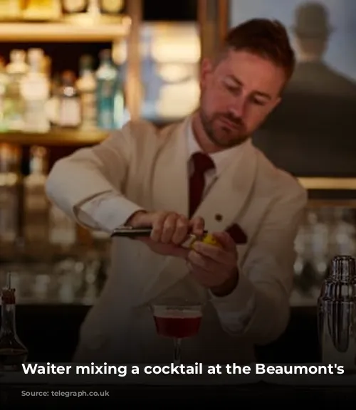 Waiter mixing a cocktail at the Beaumont's bar