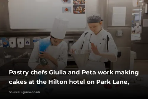 Pastry chefs Giulia and Peta work making fresh cakes at the Hilton hotel on Park Lane, London