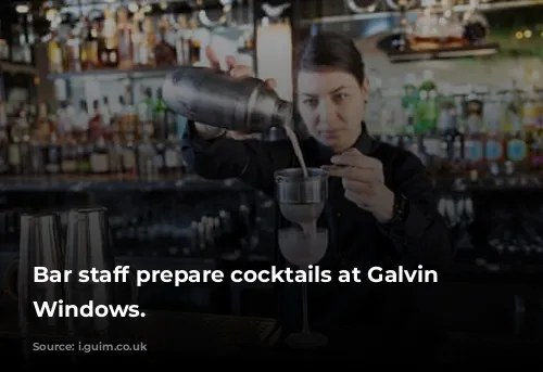 Bar staff prepare cocktails at Galvin at Windows.