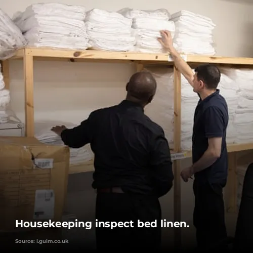 Housekeeping inspect bed linen.