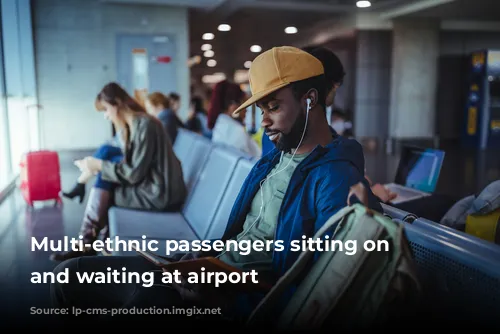 Multi-ethnic passengers sitting on bench and waiting at airport