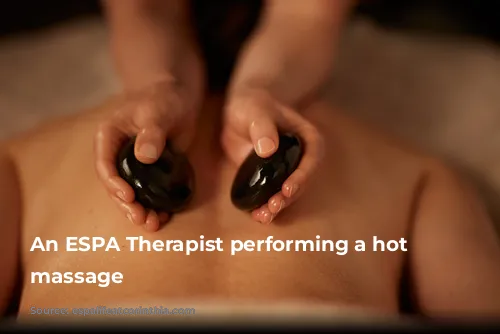 An ESPA Therapist performing a hot stone massage